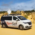 A photo of the TerrSat van, in a desert area.