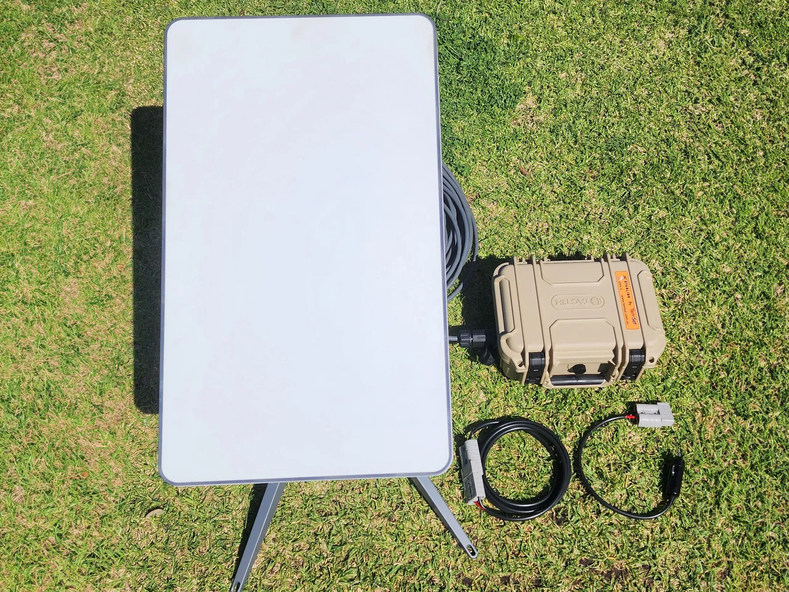 A photo of the starlink converter and a modem from above.